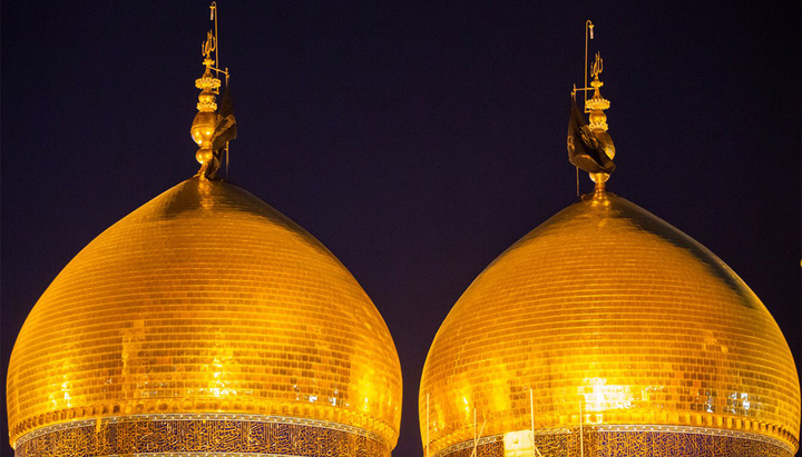 The Holy Shrines of Imam Hussain and Imam Al-Kadhum witness raising black banners on the martyrdom anniversary of Imam Al-Jawad (PBUH)