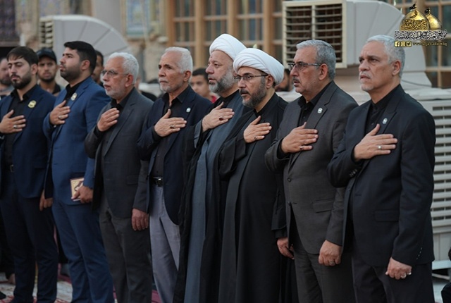 برافراشتن پرچم متبرک امام حسن مجتبی (ع) بر گنبد آستان مقدس کاظمیه