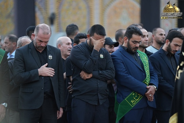 برافراشتن پرچم متبرک امام حسن مجتبی (ع) بر گنبد آستان مقدس کاظمیه