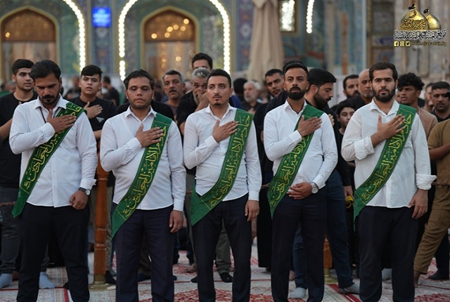 برافراشتن پرچم متبرک امام حسن مجتبی (ع) بر گنبد آستان مقدس کاظمیه