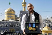 Iranian world champion wrestler dedicates gold silvers to Imam Reza shrine’s museum