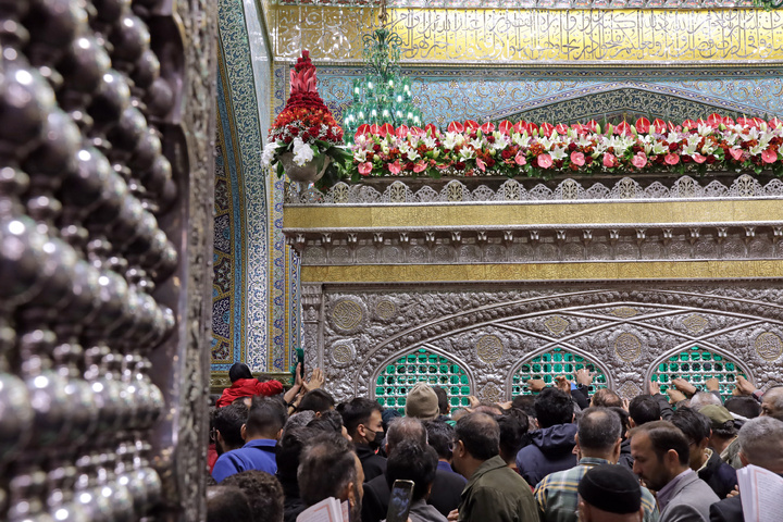 Imam Reza’s tomb decorated with flowers
