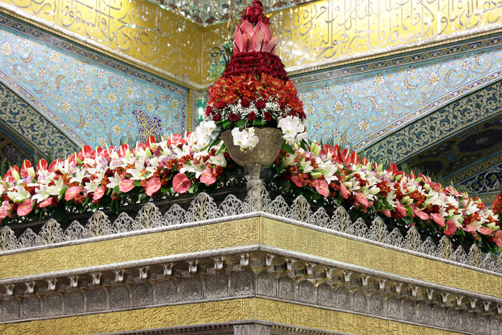 Imam Reza’s tomb decorated with flowers
