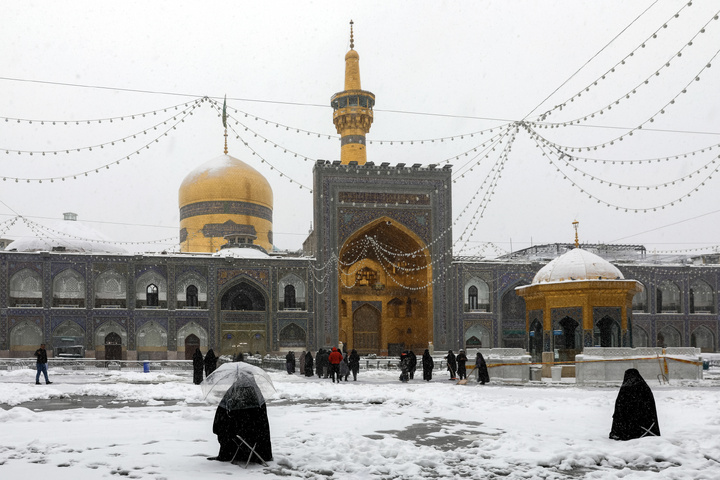 Autumn snow blankets Imam Reza shrine