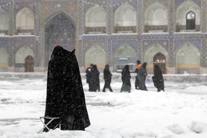 Autumn snow blankets Imam Reza shrine