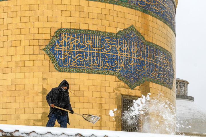 Autumn snow blankets Imam Reza shrine