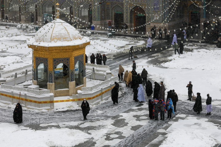 Autumn snow blankets Imam Reza shrine