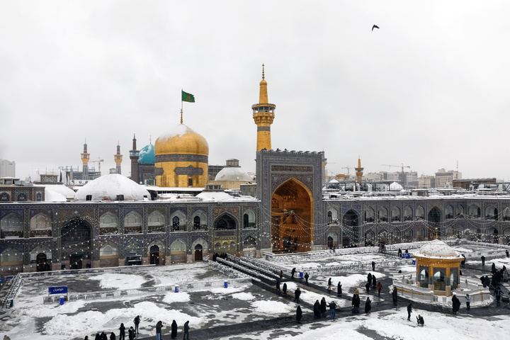 Autumn snow blankets Imam Reza shrine