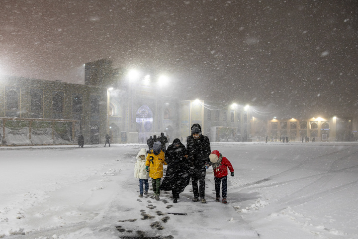 Autumn snow blankets Imam Reza shrine