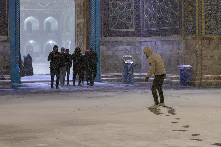 Autumn snow blankets Imam Reza shrine