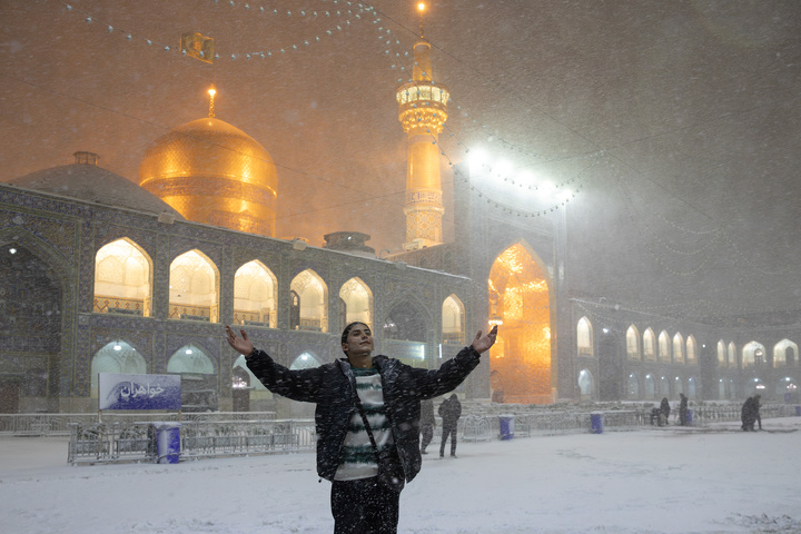 Autumn snow blankets Imam Reza shrine