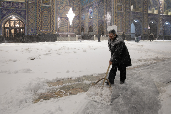 Autumn snow blankets Imam Reza shrine