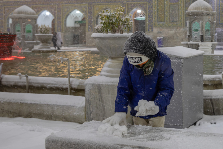 Autumn snow blankets Imam Reza shrine