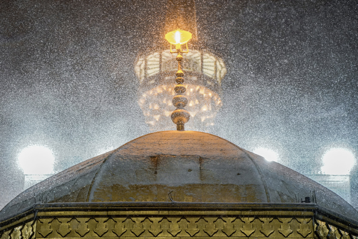 Autumn snow blankets Imam Reza shrine