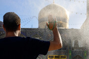 Rosewater sprinkling at holy shrine