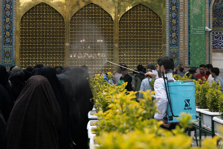 Rosewater sprinkling at holy shrine