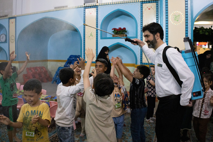 Rosewater sprinkling at holy shrine