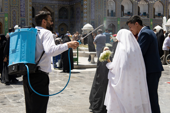Rosewater sprinkling at holy shrine