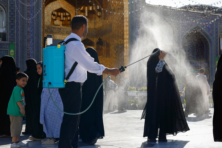 Rosewater sprinkling at holy shrine