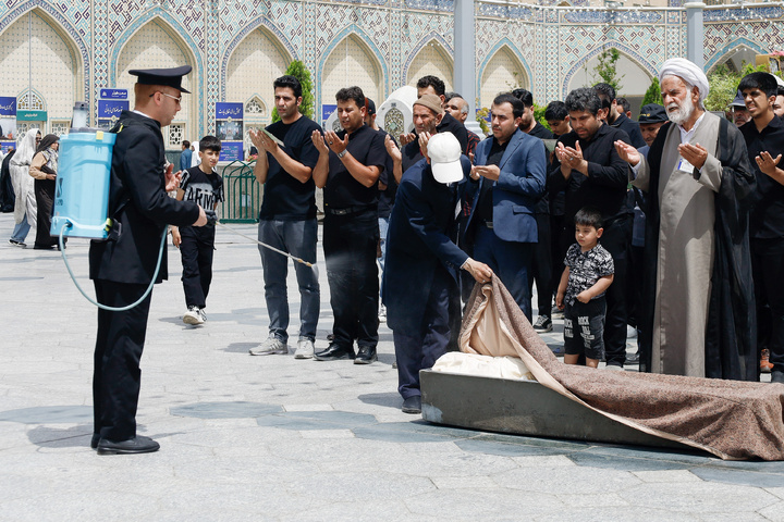 Rosewater sprinkling at holy shrine