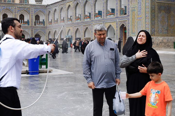 Rosewater sprinkling at holy shrine