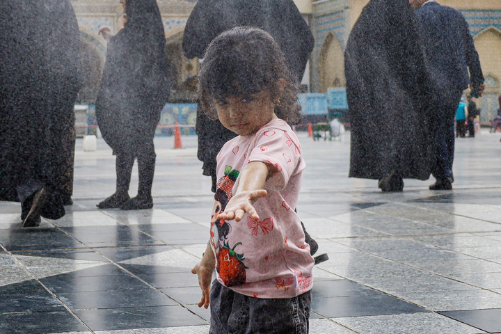 Rosewater sprinkling at holy shrine