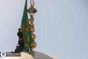 مراسم تغيير کسوة القبر الشریف وراية القبة الرضوية في ذكرى میلاد إمام الرحمة