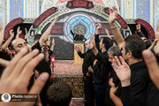 Tasua night atmosphere fills Imam Reza Shrine