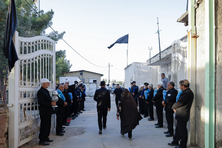 Imam Javad Mukib serves pilgrims walking to Imam Reza Shrine