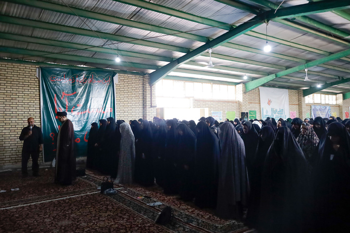 Imam Javad Mukib serves pilgrims walking to Imam Reza Shrine