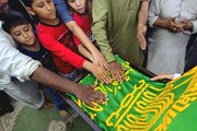 زیرسایه خورشید در «باب‌العلم» کراچی؛ تجدید عهد شیعیان با پرچم رضوی